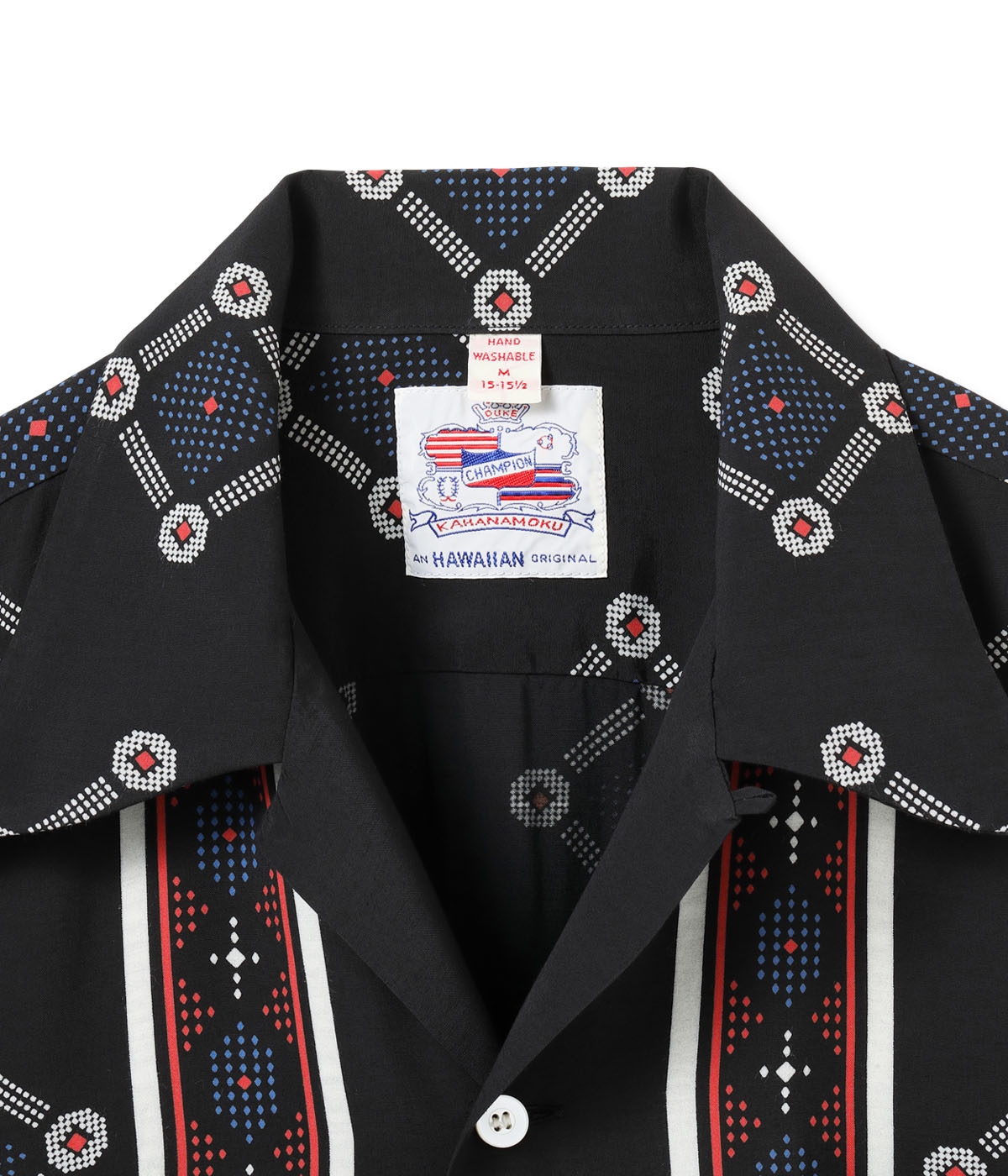 TITLE: “WESTCOAST PATTERN” ORIGINAL BRAND NAME: DUKE KAHANAMOKU ESTIMATED MANUFACTURING DATES: EARLY 1950s FABRIC: RAYON FUJIETTE PRINTING METHOD: DISCHARGE PRINTING PRINTING PATTERN: BORDER PATTERN BUTTON: WHITE SHELL BUTTON